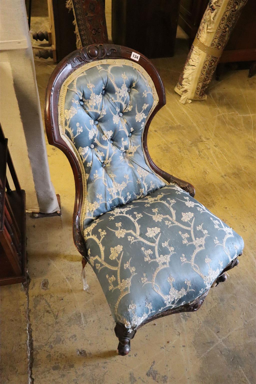 A Victorian walnut show wood upholstered nursing chair on casters